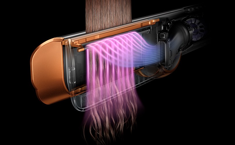 Proud vzduchu vlasy urovná a pomáhá vytvořit hladký účes